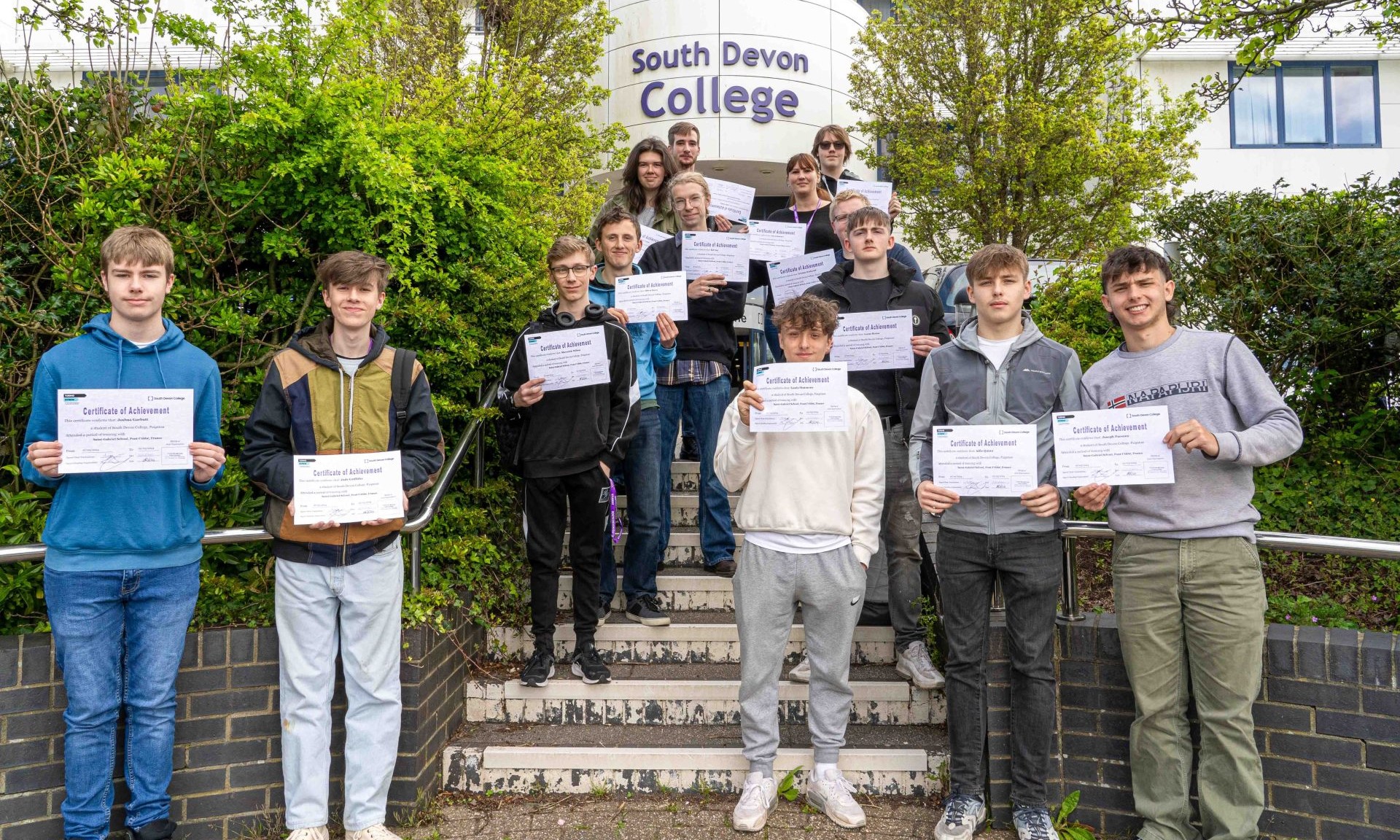 South Devon College students show off their participation certificates after their Brittany placement.